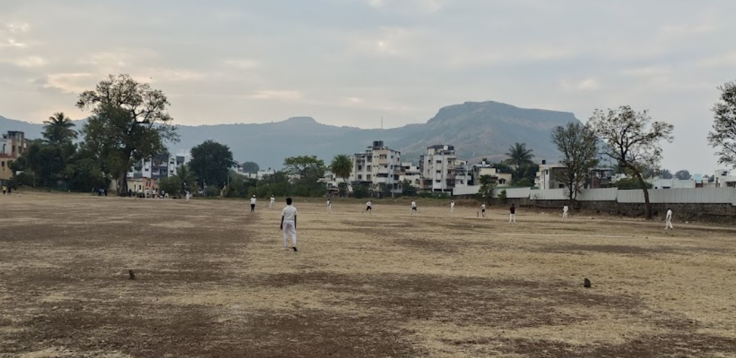 Cricket being played on the Koteshwar Maidan (Source: CKA Archives)