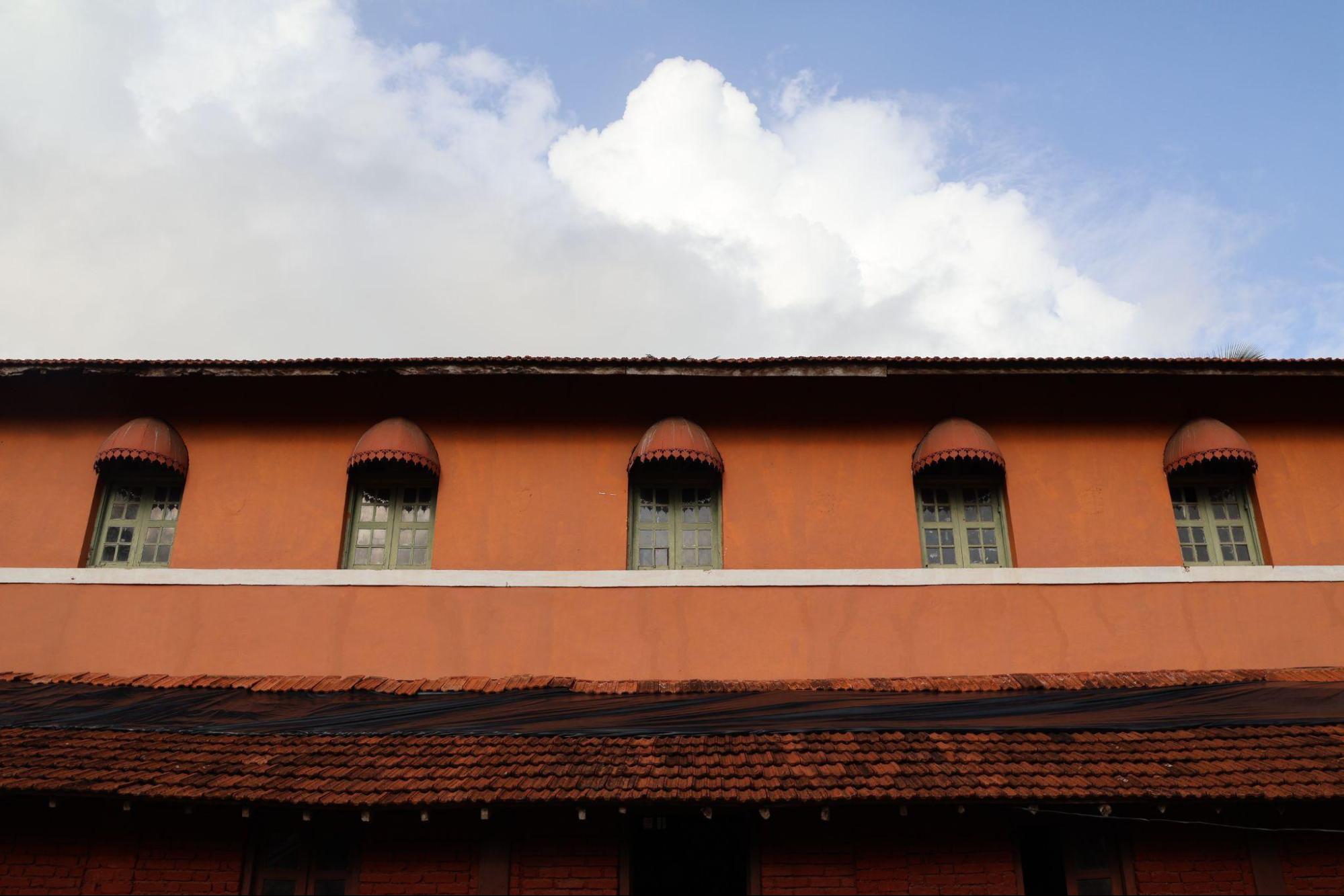 A series of palace windows featuring protectivechajjas. These small overhanging canopies, commonly found in traditional architecture, provide shade and rain protection while adding a layer of detail to the façades. (Source: CKA Archives)
