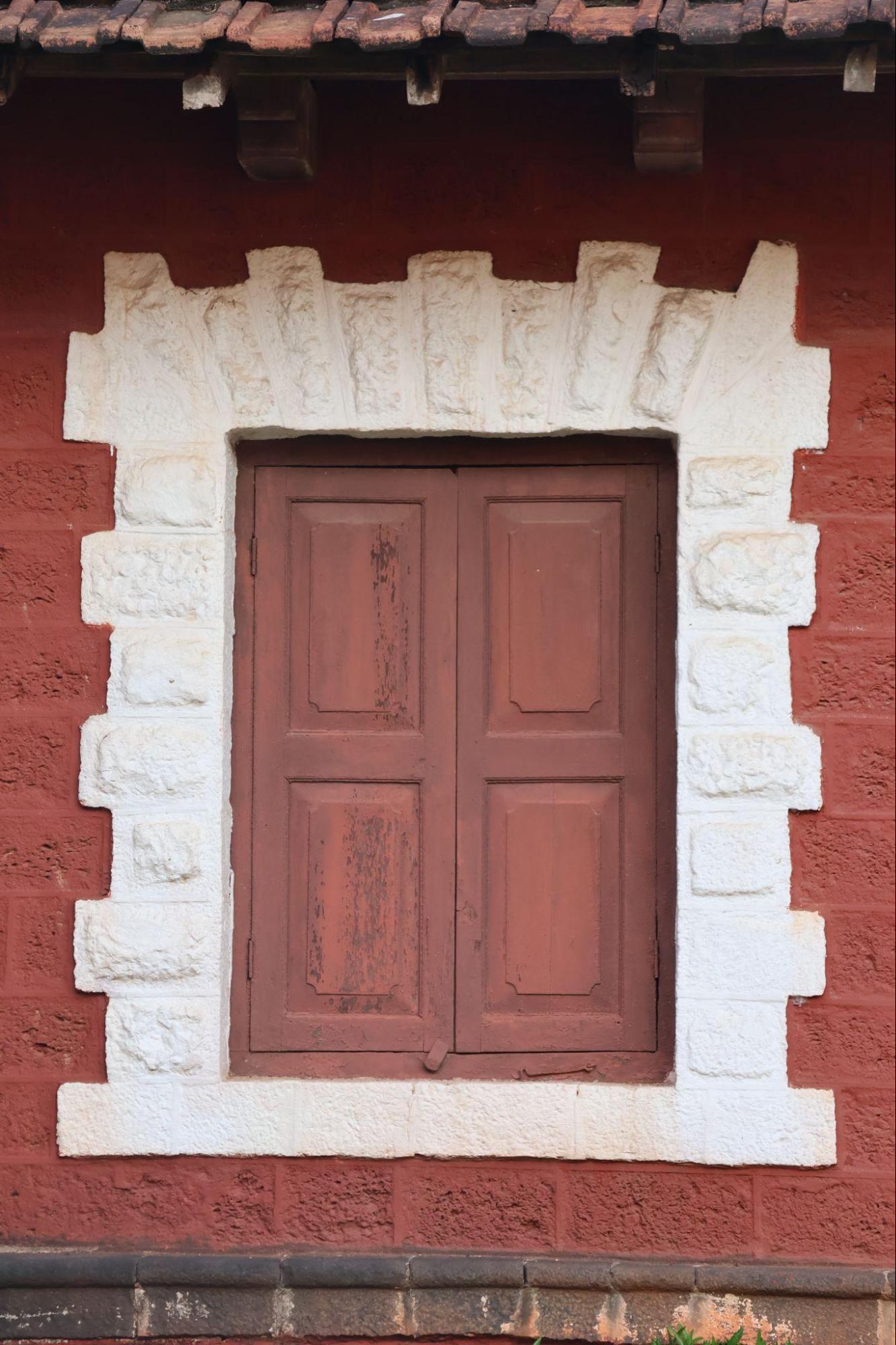 Traditional window with wooden panels on the outside. This provides security, while also maintaining the wooden, brown appearance of the palace. (Source: CKA Archives)