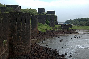 Vijaydurg Fort, historically known as Gheria, was first constructed under Raja Bhoja II of the Shilahara dynasty in the late 12th century. Situated at the mouth of the Vaghotan River, it later rose to prominence as a major naval base under the Marathas.