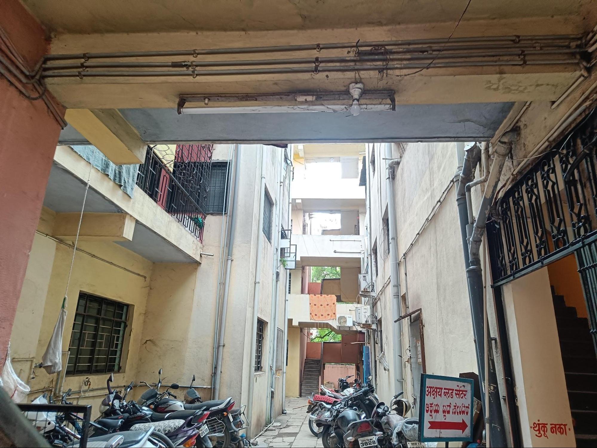 Congested entrance of the residence. Such parking arrangements are said to be common across buildings, where limited space and a high number of personal vehicles lead to congestion. (Source: CKA Archives)