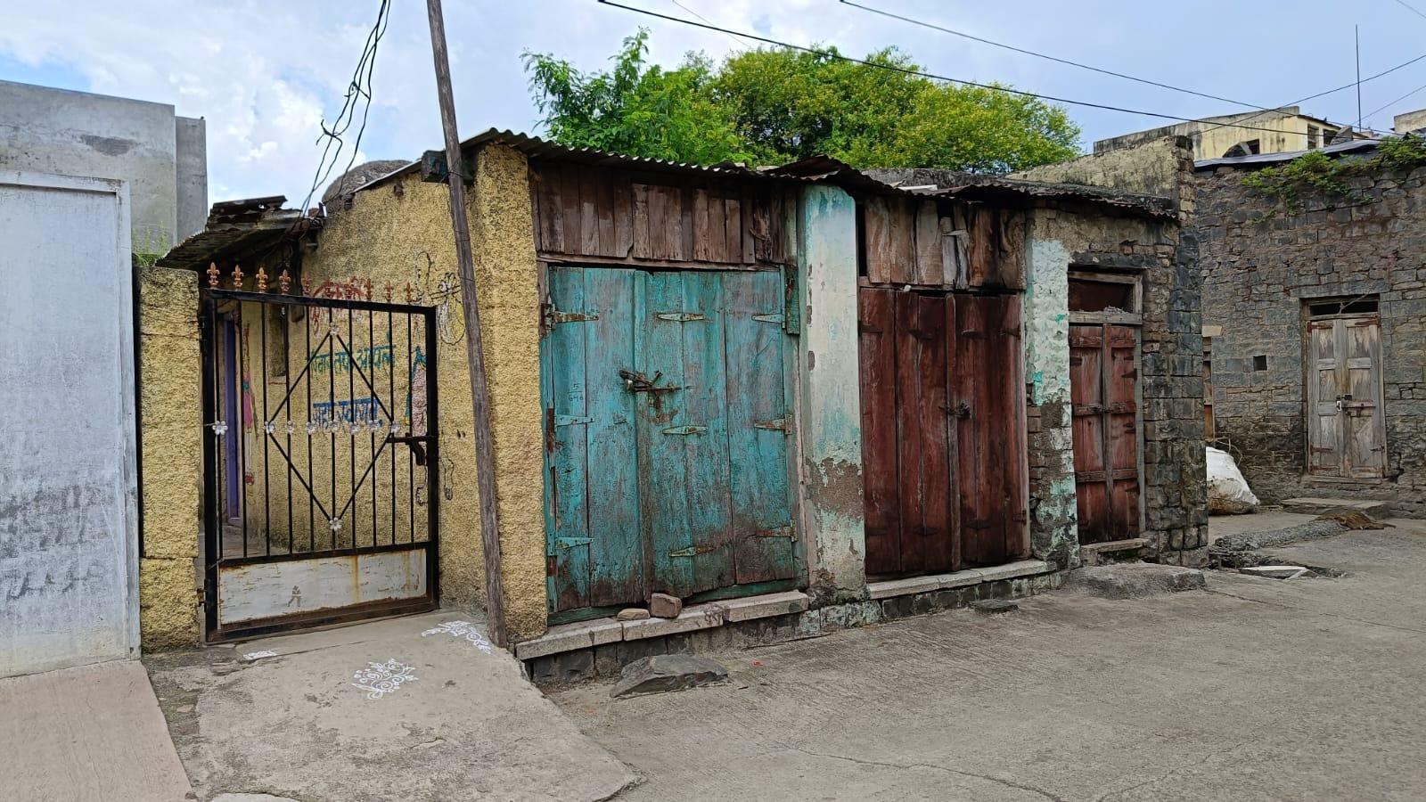 Entrance of the house with murals painted on the passageway. (Source: CKA Archives)