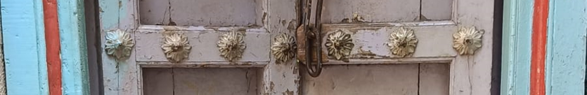 Iron spikes adorning the main door for protection. Interestingly, instead of using a traditional design, decorative flowers have been added to add a decorative element. (Source: CKA Archives)