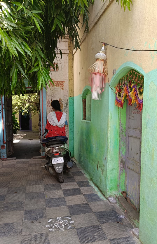 The front view of the house features a toran and akashkandil. (Source: CKA Archives)