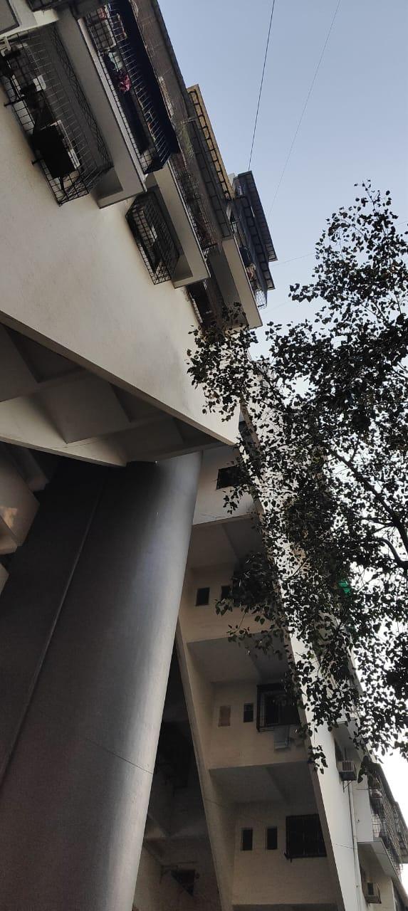 Window grills differ in design and scale, added individually by flat owners over time, resulting in a patchwork of metalwork styles.(Source: CKA Archives)