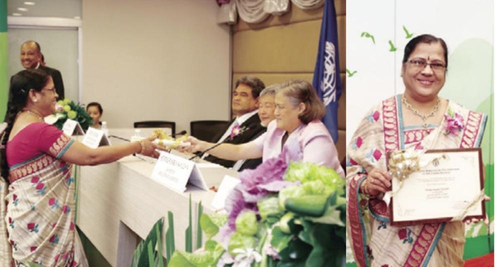 Shailaja Popatlal Navander accepting her U.N. agency award in Bangkok, 2014.