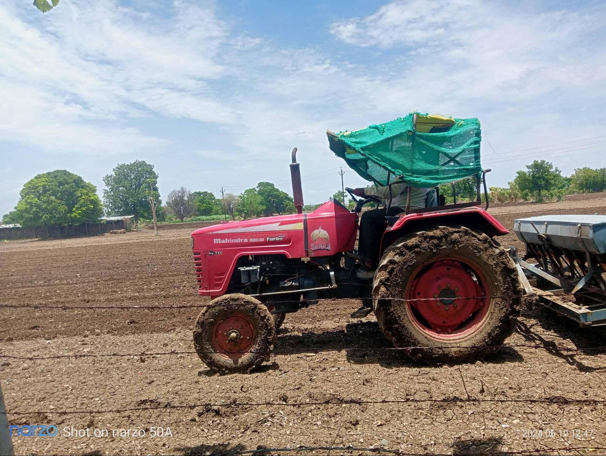 A tractor is being used on a farm. (Source: CKA Archives)