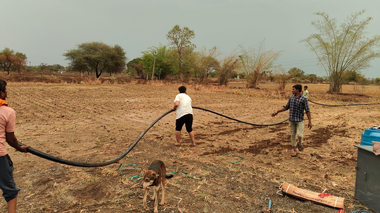 People assembling an irrigation system. (Source: CKA Archives)