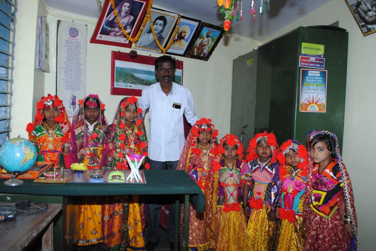Jagdish Kude with students dressed up for a performance. (Source: CKA Archives)