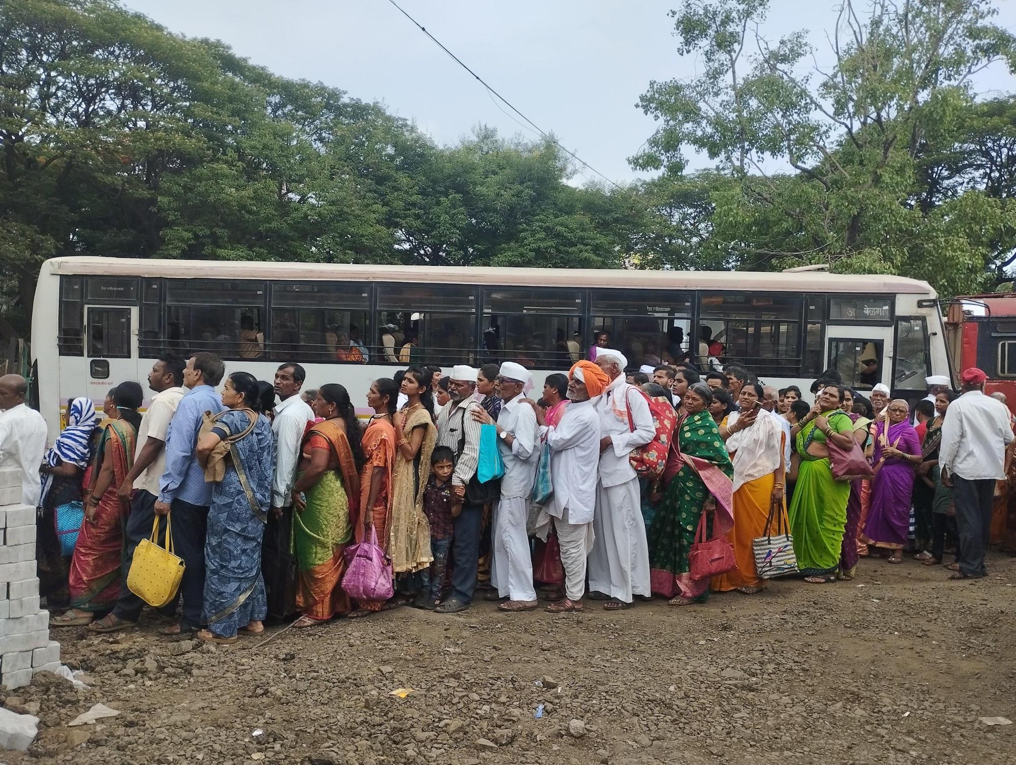 Visitors to Kolhapur stand in line to catch a bus to Jyotiba Wadi in Kolhapur district. (Source: CKA Archives)