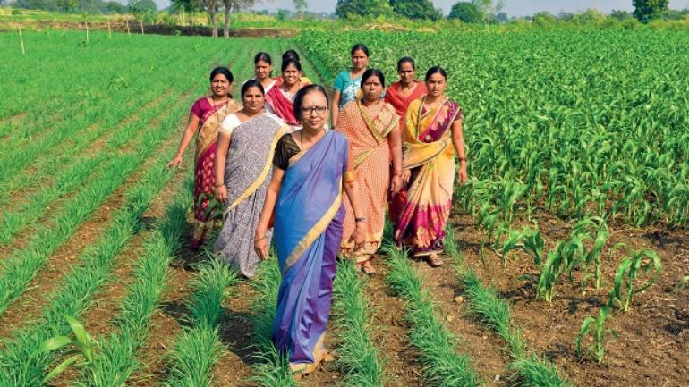The late Prema Gopalan, co-founder of Swayam Shikshan Prayog, with women farmers. Source: Indian Wire.
