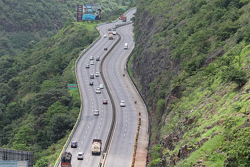 The Mumbai–Pune Expressway, opened in 2002, runs parallel to the historic Bhor Ghat route, transforming what was once a narrow forest track into a modern highway.