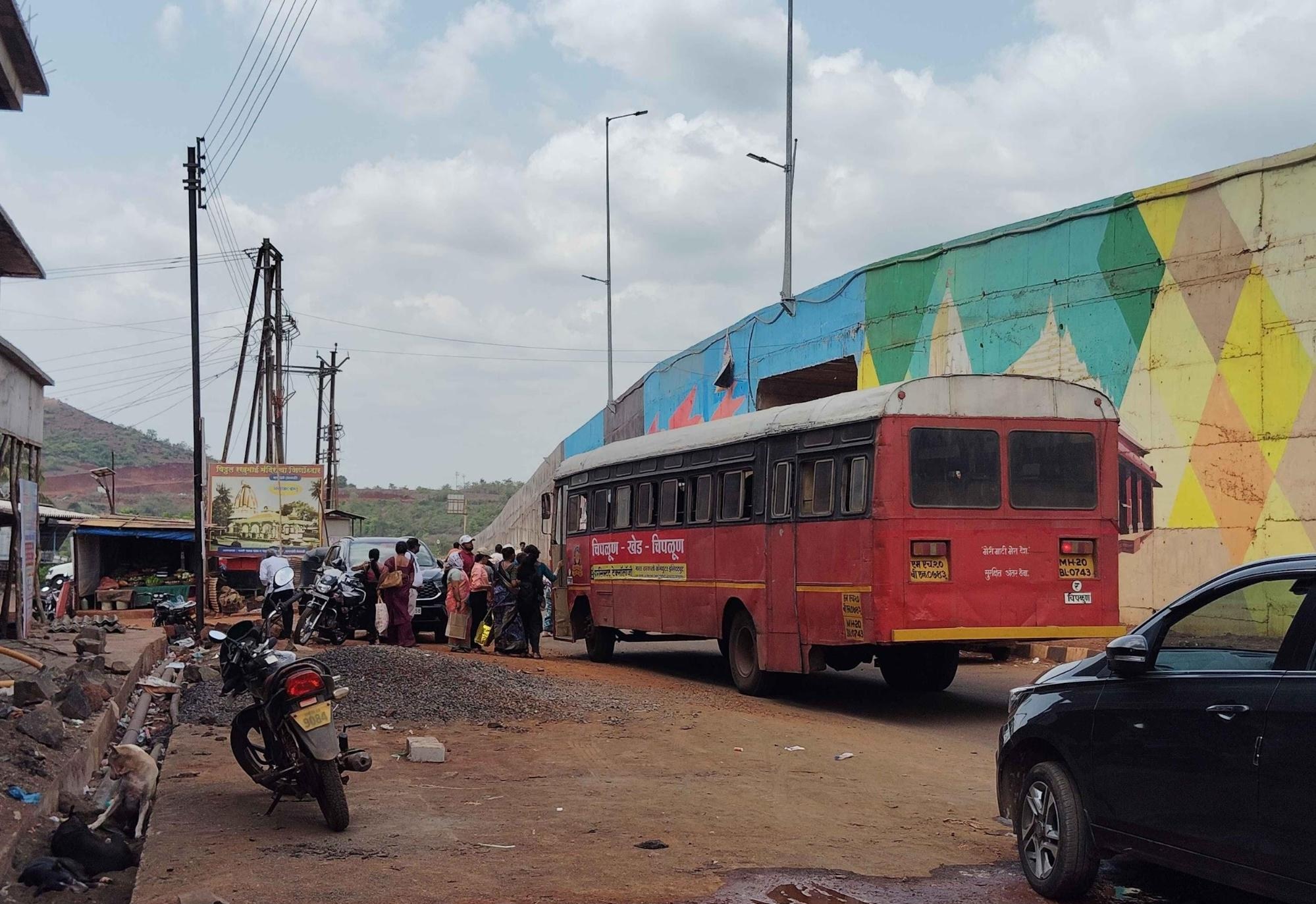 Lal Pari bus halting to pick up passengers along a highway in Ratnagiri district.These iconic red MSRTC buses have long served as a lifeline for inter-village and inter-district travel. (Source: CKA Archives)