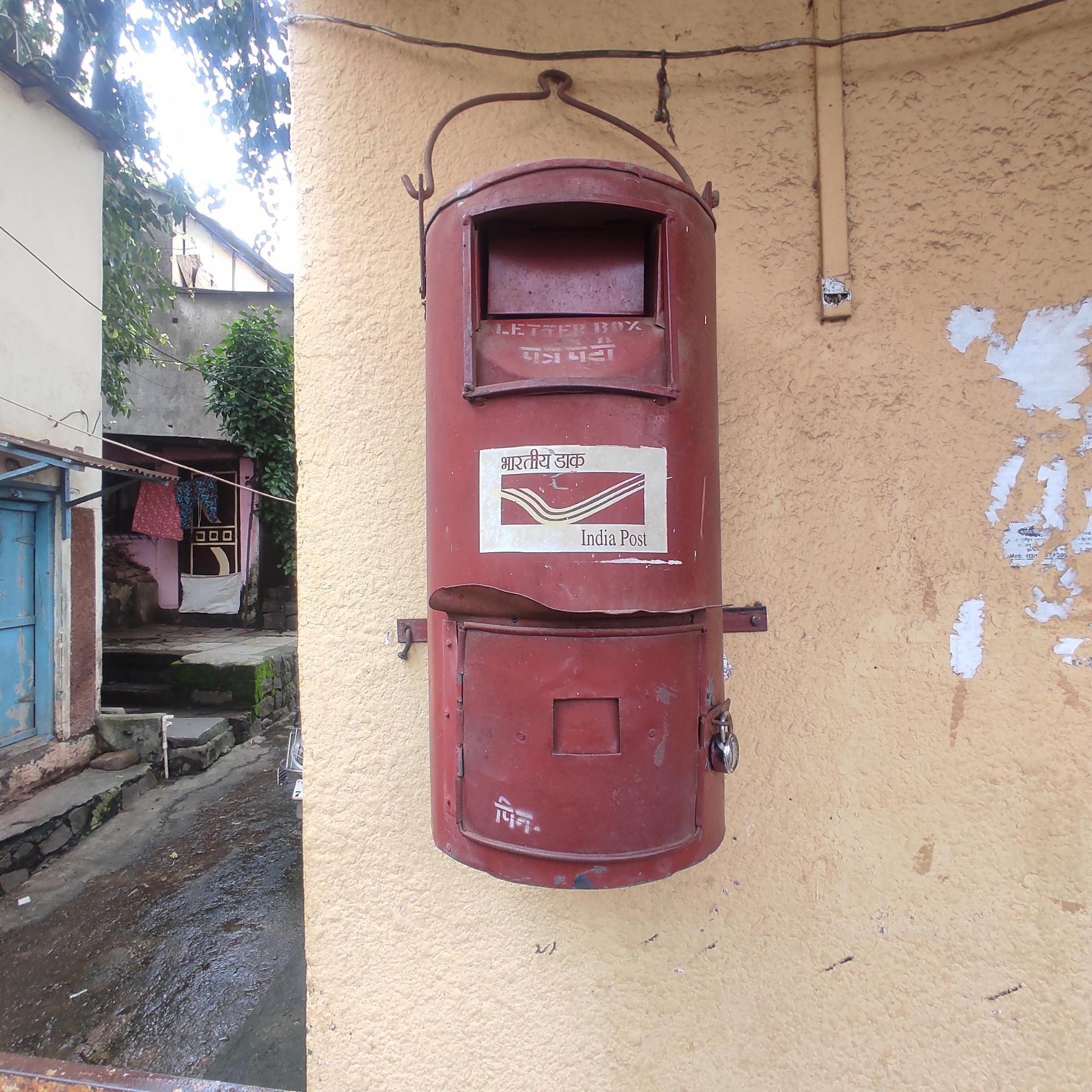 Traditional India Post letterbox outside a home in Satara district.These red post boxes remain a familiar part of rural landscapes, continuing to serve local communities despite the rise of digital communication. (Source: CKA Archives)